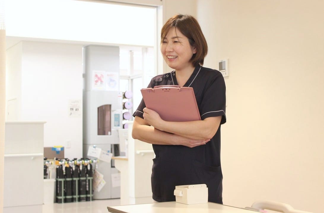 患者さんに寄り添うK・Tさんの様子